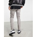 DESIGN skinny jeans with rips and raw hem in washed grey