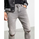 DESIGN skinny jeans with rips and raw hem in washed grey