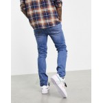 DESIGN skinny jeans in mid wash blue with knee rips