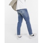 DESIGN high rise regular jeans in mid blue 90's wash with abrasions
