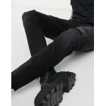 Pull&Bear premium carrot fit jeans with rips in black