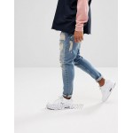 DESIGN drop crotch jeans in vintage light wash blue with heavy rips