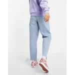DESIGN relaxed tapered jeans in vintage light wash blue with raw hem