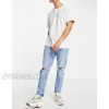  DESIGN tapered carrot jeans in light wash blue with knee rips  