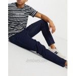 DESIGN tapered jeans in indigo