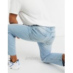 DESIGN relaxed tapered jeans in vintage light blue stone wash