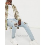 DESIGN skinny jeans in vintage light wash with rips