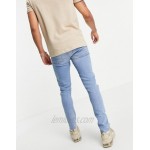 DESIGN skinny jeans in vintage mid blue with knee rip and abrasion