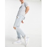 DESIGN skinny jeans with heavy rips in vintage light wash