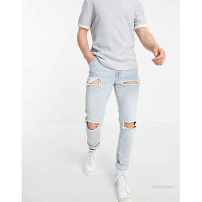  DESIGN skinny jeans with heavy rips in vintage light wash  