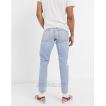 DESIGN slim jeans in vintage light wash blue with heavy rips