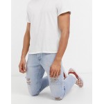 DESIGN slim jeans in vintage light wash blue with heavy rips