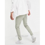 DESIGN skinny smart sweatpants in green crinkle linen