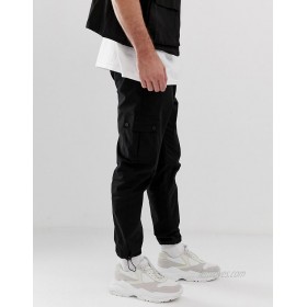  DESIGN tapered cargo pants in black with toggles  
