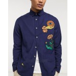 DESIGN navy overshirt in natural fibers with embroidery placement detail